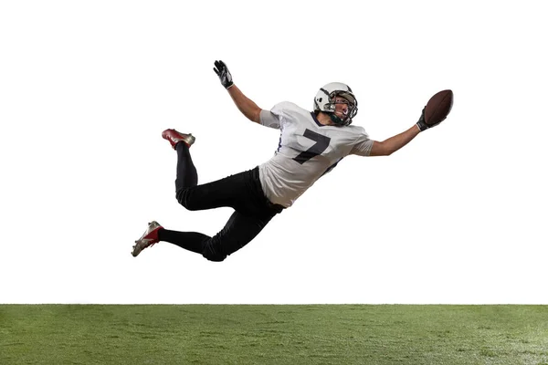 Portrait of American football player catching ball in jump isolated on white studio background. — Stock Photo, Image