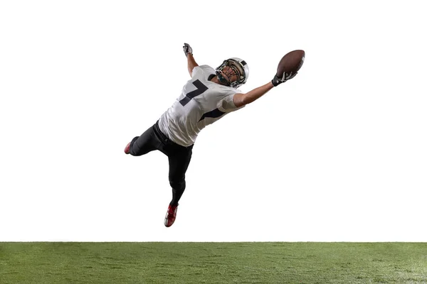 Portrait of American football player catching ball in jump isolated on white studio background. — Stock Photo, Image