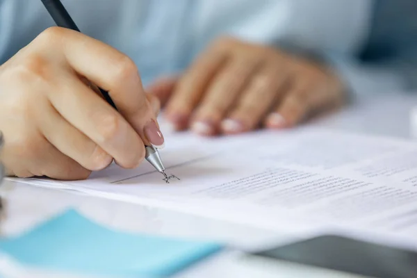 Close up of female hands signing business contract. Concept of female business, online education, professional occupation Stock Picture