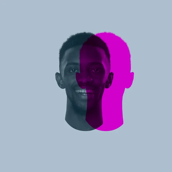 Close-up jovem cara de homem Africano, cabeça com silhueta colorida, sombra isolada no fundo de luz. Emoção humana, personalidade dividida, conceito de problemas mentais. — Fotografia de Stock