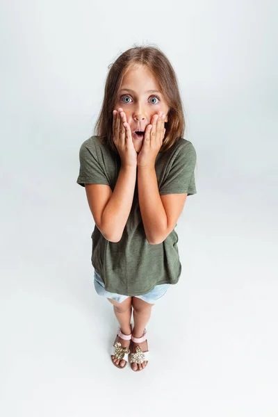 High angle view of Caucasian preschool girl isolated on white studio background. Copyspace for ad. Childhood, education, emotion concept — 图库照片