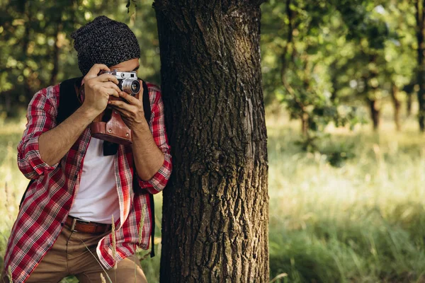 In summer in nature. Close-up young man walking, strolling alone outskirts of city. Beautiful landscape views. Active lifestyle, travel concept — Stock Photo, Image