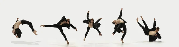 Schweben. Erstaunliche Leistung eines flexiblen männlichen Balletttänzers, der isoliert auf weißem Hintergrund übt. Konzept von Kunst, Schönheit, Streben, Kreativität. — Stockfoto