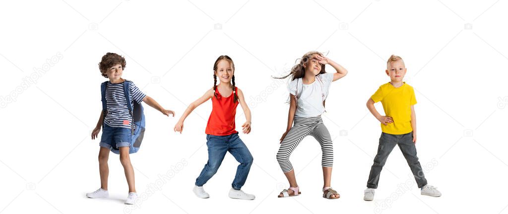 Horizontal collage made of portraits of little happy kids running isolated on white studio background. Human emotions, facial expression concept