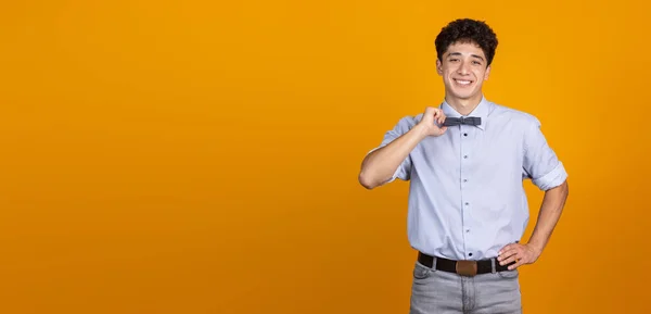 Half-length portrait of young curly man isolated over yellow studio background with copyspace for ad. Concept of human emotions, fashion, beauty, youth — Stock Photo, Image