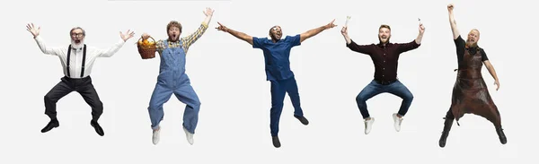 Collage of happy men, professor, farmer, doctor, smith and architector jumping isolated on white studio background. Horizontal flyer, collage — Stock Photo, Image