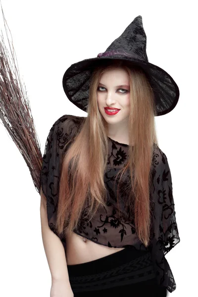 Girl in witch costume with a broom — Stock Photo, Image