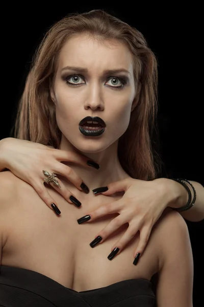 Gothic  brunette woman with hands on neck — Stock Photo, Image