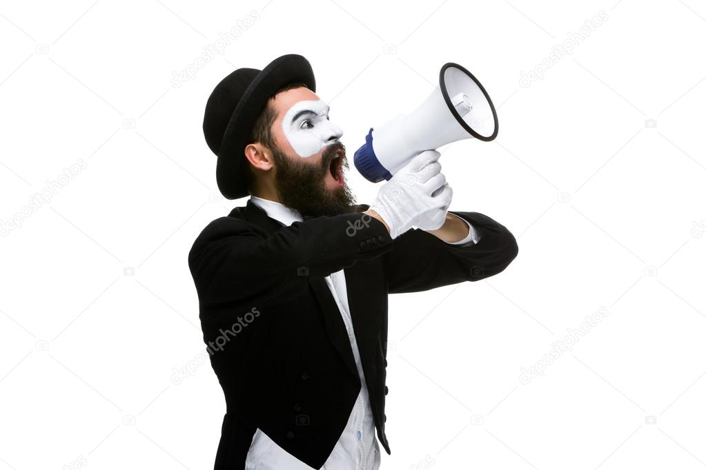 Man with a face mime screaming into megaphone