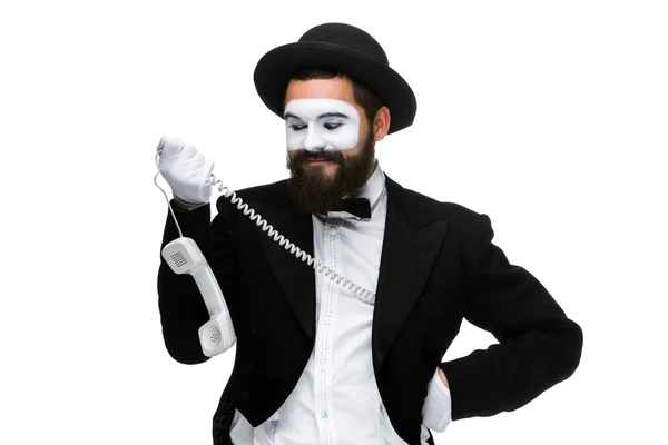 Man in the image mime holding a handset. — Stock Photo, Image