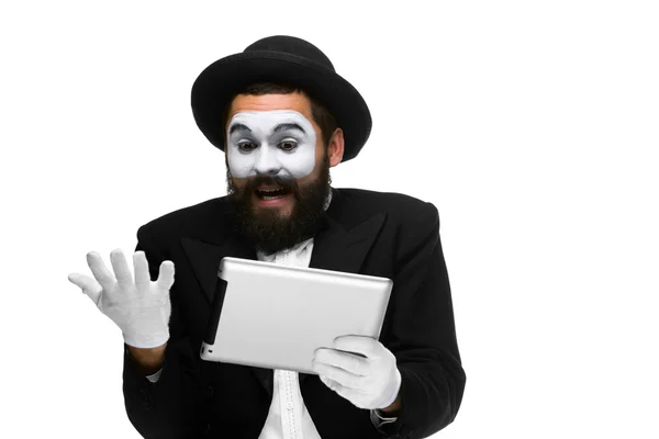 Man with a face mime working on laptop — Stock Photo, Image