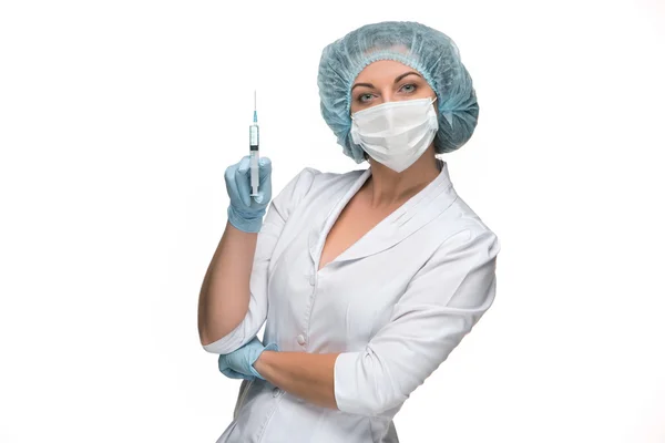 Portrait of lady surgeon showing syringe over white background — Stock Photo, Image