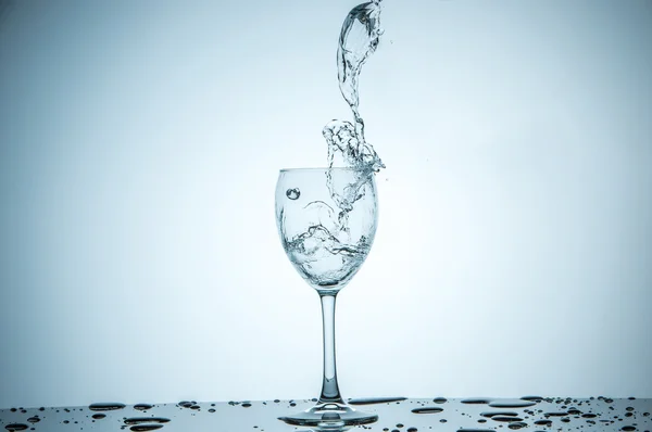 Glass being filled with water — Stock Photo, Image