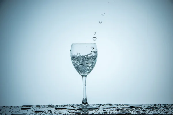 Glass being filled with water — Stock Photo, Image