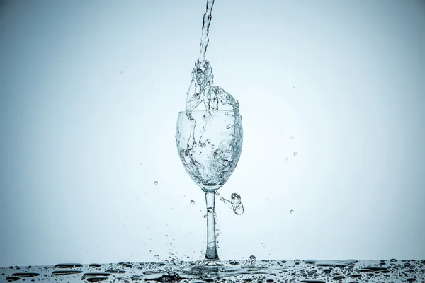 Glass being filled with water — Stock Photo, Image