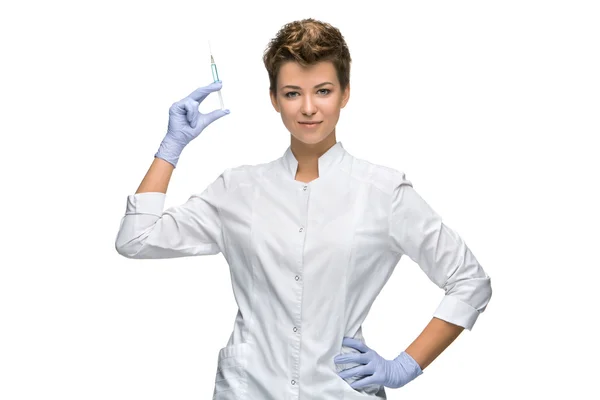 Portrait of lady surgeon showing syringe — Stock Photo, Image