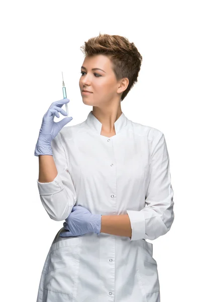 Portrait of lady surgeon showing syringe — Stock Photo, Image