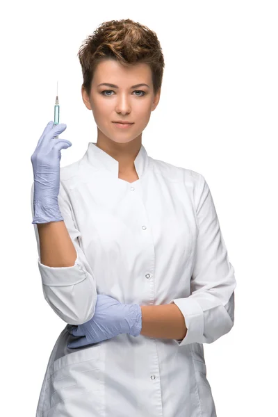 Portrait of lady surgeon showing syringe — Stock Photo, Image