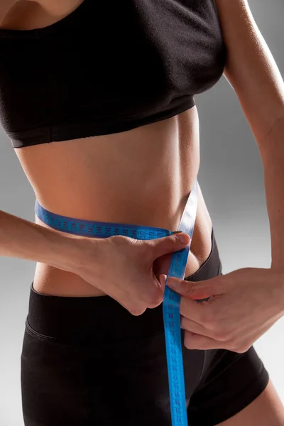 Fit and healthy waist measured with a tape — Stock Photo, Image