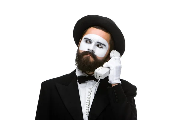 Man in the image mime holding a handset. — Stock Photo, Image