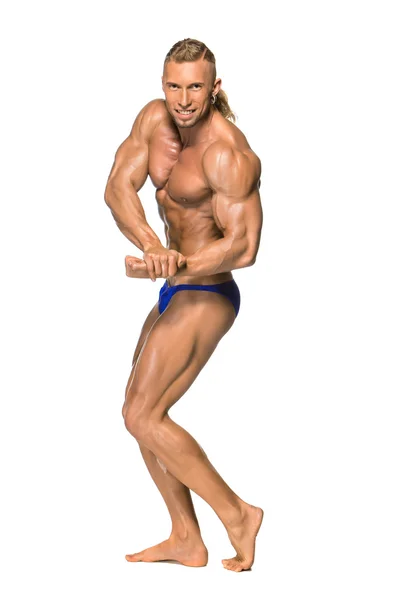 Aantrekkelijke mannelijke lichaam bouwer op witte achtergrond — Stockfoto