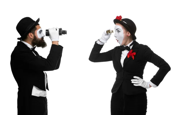 Two memes as business people looking at each other through binoculars — Stock Photo, Image