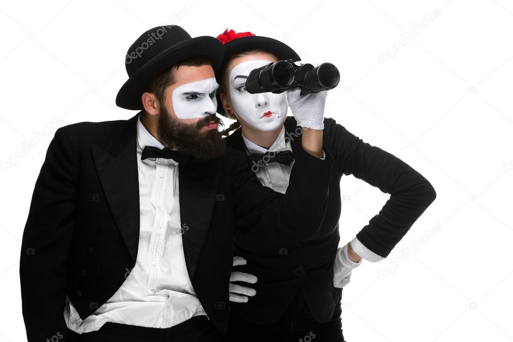 Two memes as business people looking through binoculars