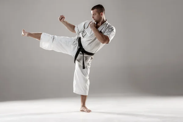 Man in white kimono training karate — Stok Foto