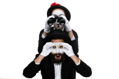 Two memes as business people looking through binoculars clipart