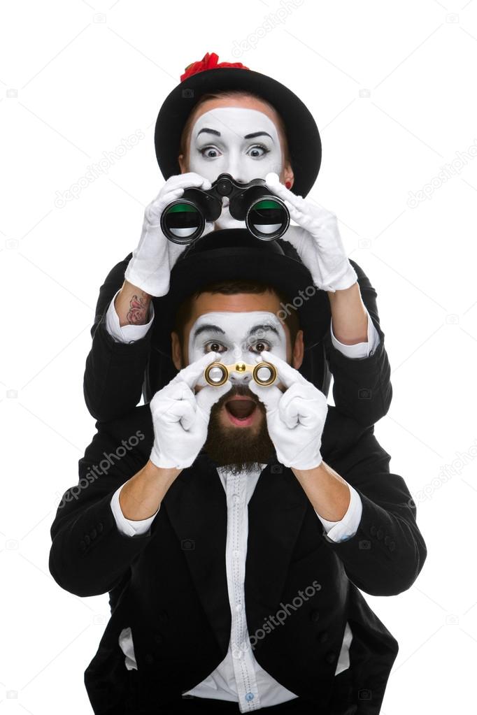 Two memes as business people looking through binoculars