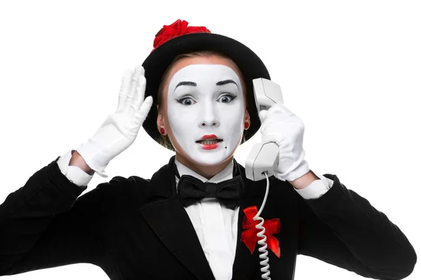 Woman in the image mime holding a handset. — Stock Photo, Image