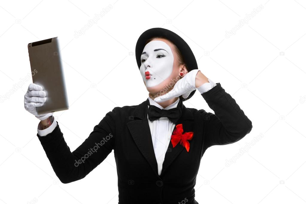business woman in the image mime holding tablet PC