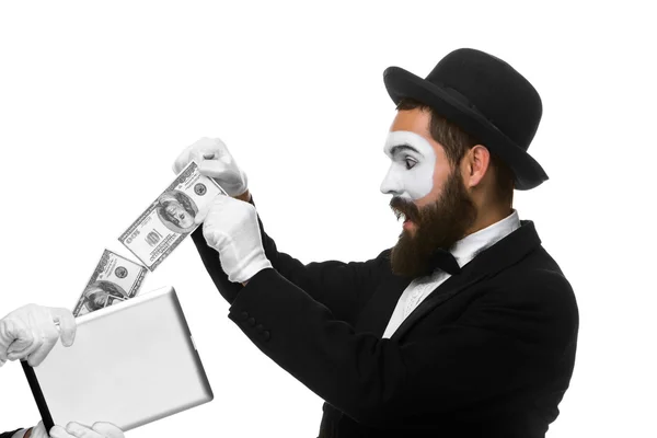 Businessmans hand in the form of mime extract money from tablet PC — Stock Photo, Image