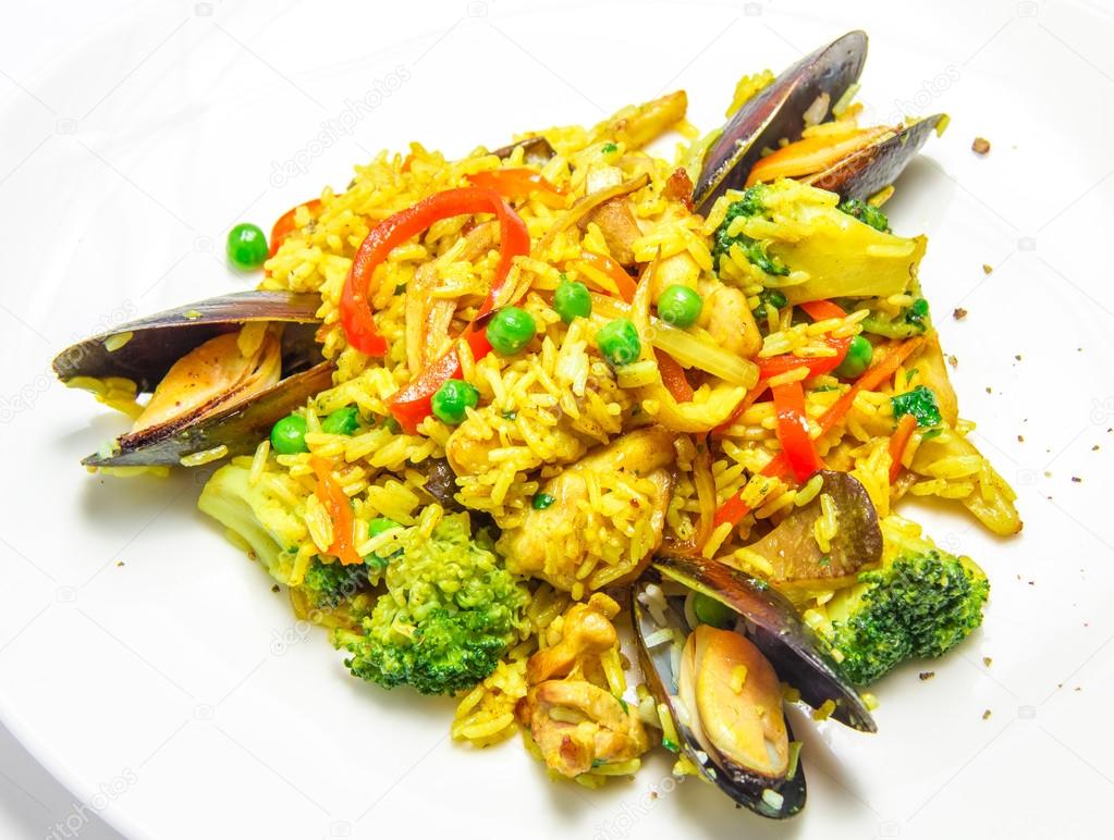 Spanish paella with mussels, food closeup
