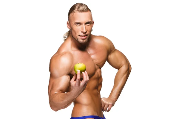 Hombre de cuerpo en forma y saludable sosteniendo una fruta e, aislado sobre fondo blanco —  Fotos de Stock