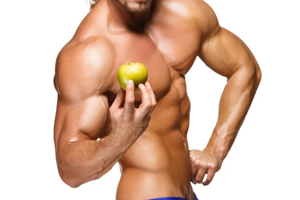 Homem de corpo em forma e saudável segurando uma fruta fresca de maçã, isolado em fundo branco — Fotografia de Stock