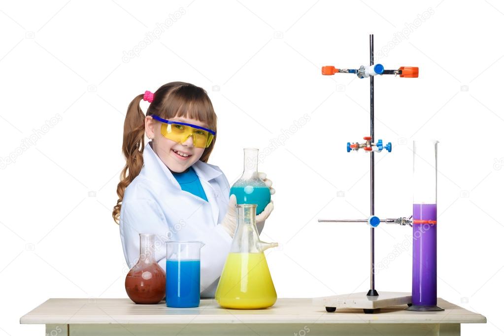 Little girl as chemist doing experiment with chemical fluid in the laboratory