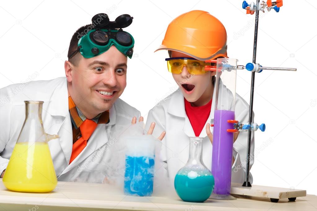 Teen and teacher of chemistry at  lesson making experiments