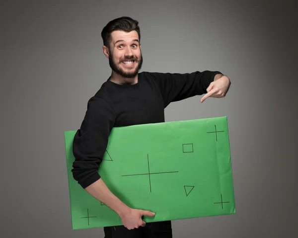 De lachende man als zakenman met groene paneel — Stockfoto