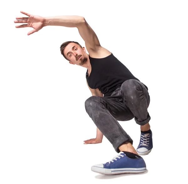 Breakdancer beim einhändigen Handstand vor weißem Hintergrund — Stockfoto
