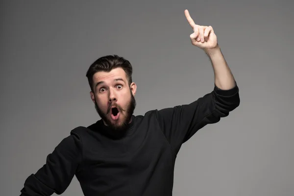 Eureka. hombre con una idea levantando el dedo en el aire —  Fotos de Stock