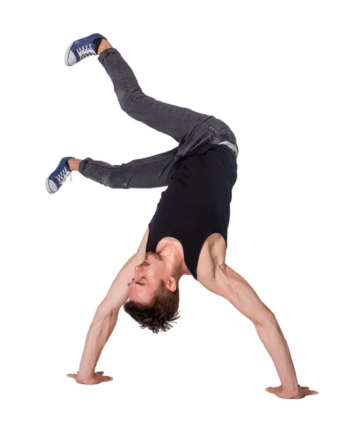 Pauze danser doen handstand tegen witte achtergrond — Stockfoto