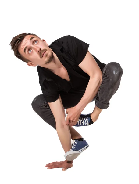 Break dancer doing one handed handstand against a white background — Stock Photo, Image