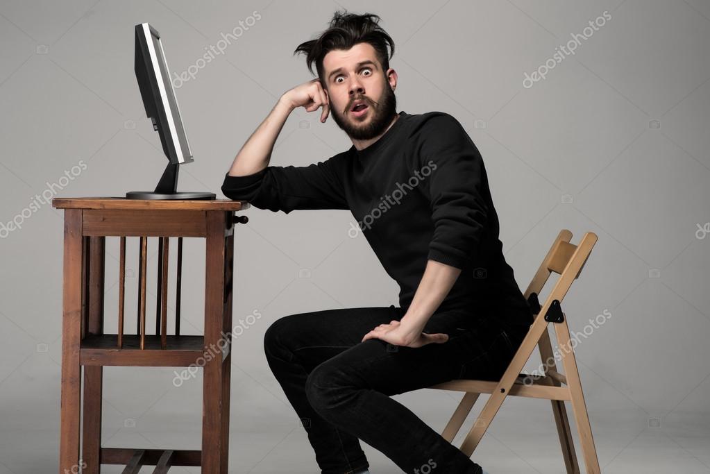 Background funny for computers Funny and crazy man using a computer