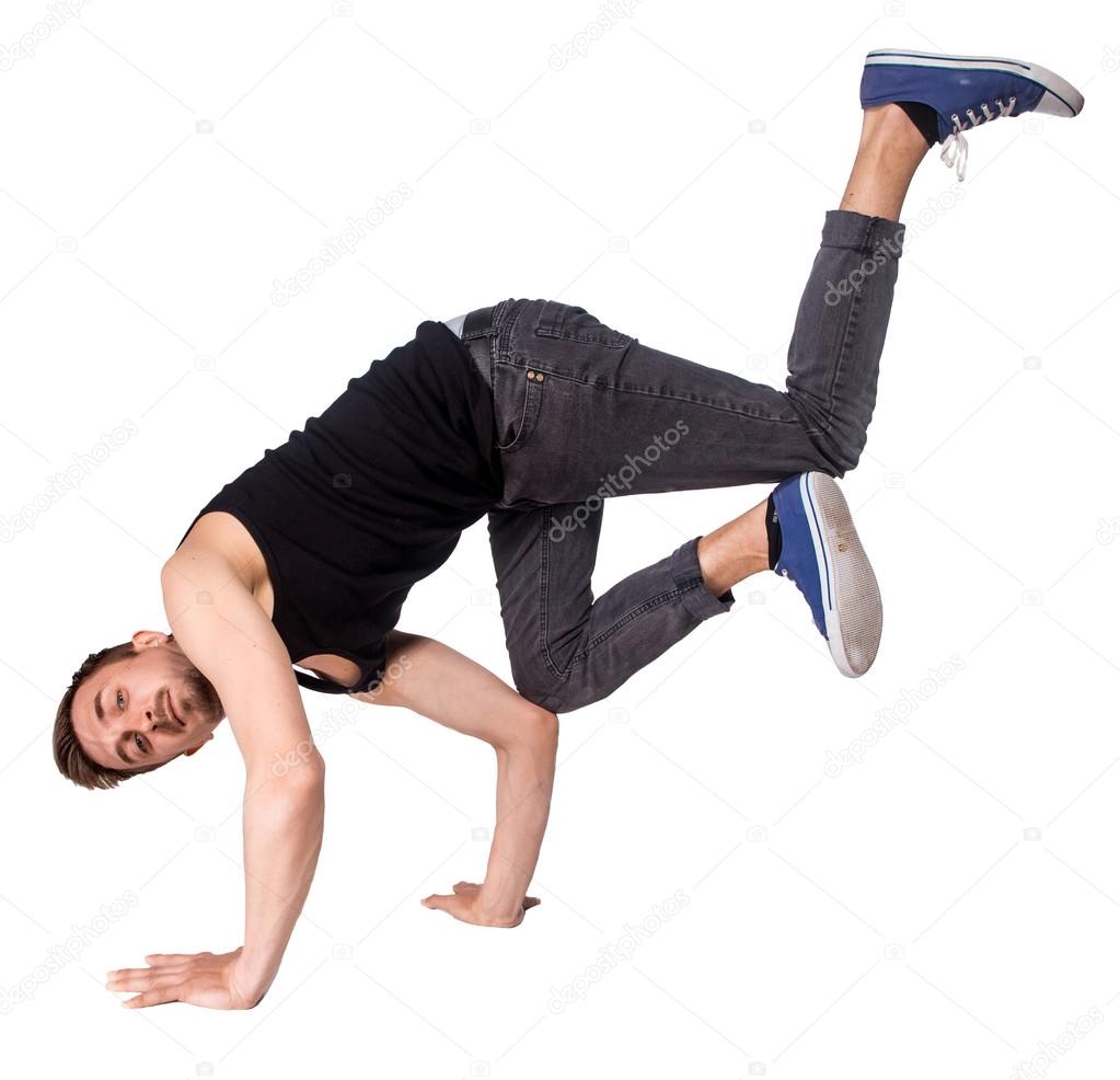 Break dancer doing handstand against  white background
