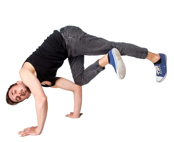 Pauze danser doen handstand tegen witte achtergrond — Stockfoto