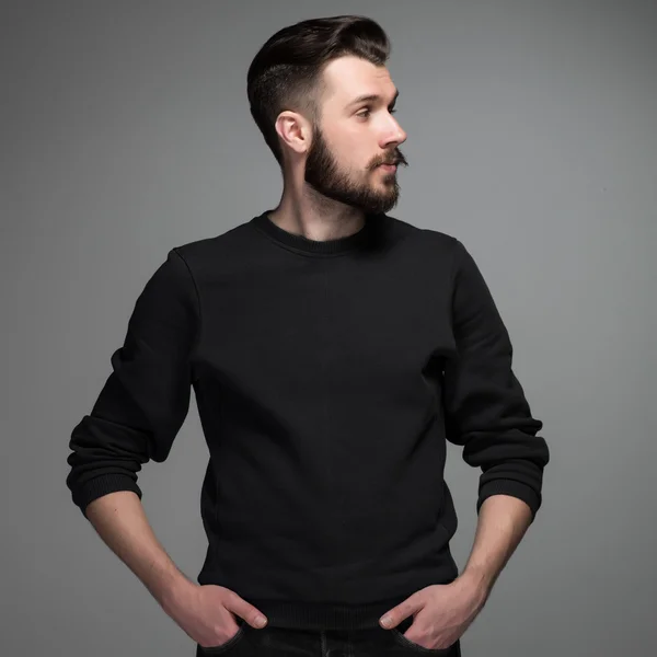 Fashion portrait of young man in black — Stock Photo, Image