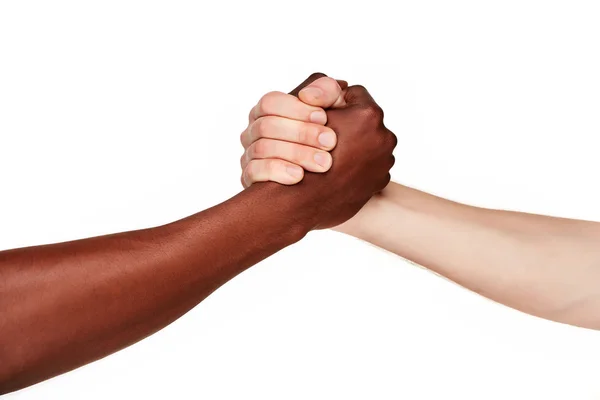 Black and white human hands in a modern handshake — Stock Photo, Image