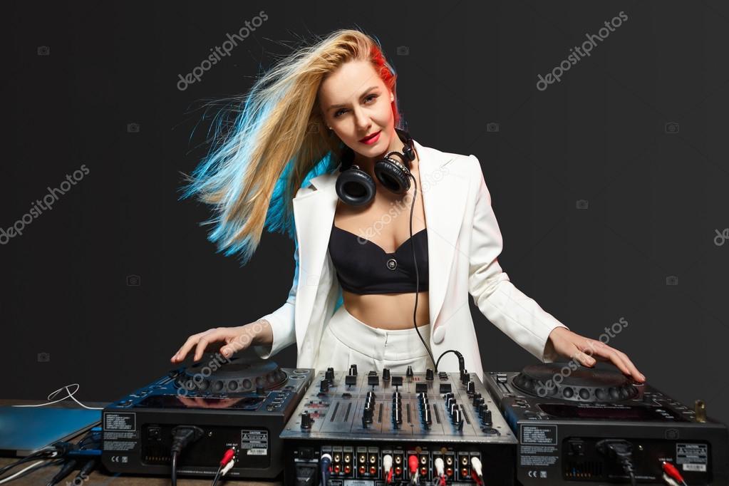 Blonde girl DJ spinning techno beats - wide 4