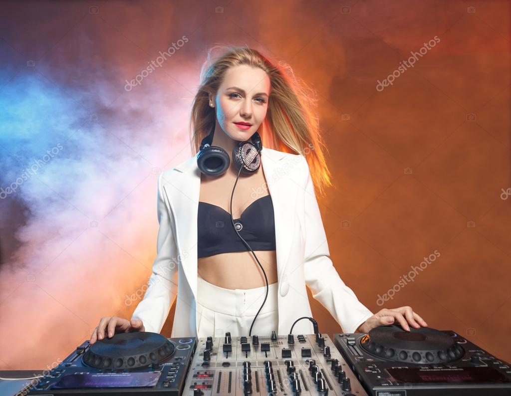 Beautiful blonde DJ girl on decks - the party, Stock Photo by  ©vova130555@ 75386099